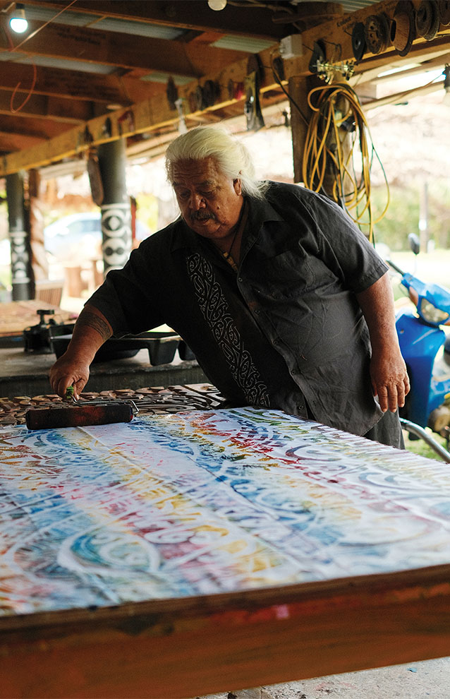 a person painting a fabric