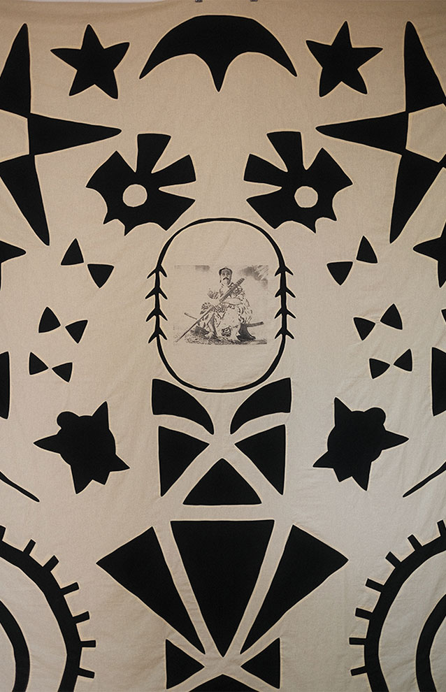 a white fabric with black and white designs