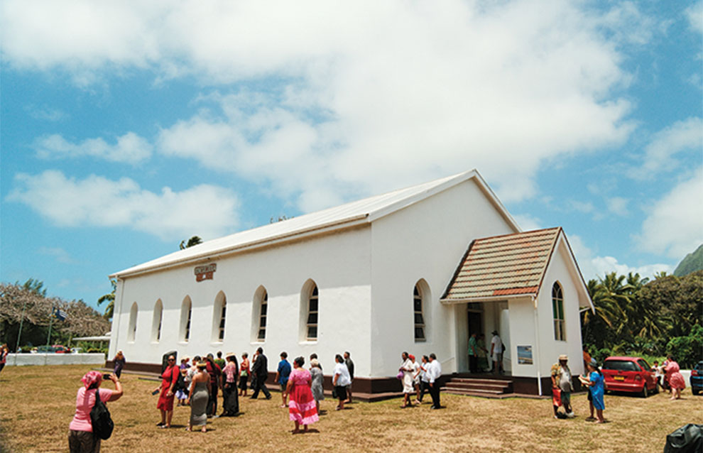 a group of people outside a church