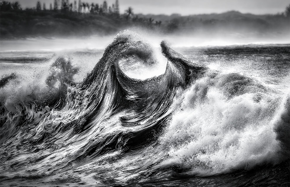 closeup of waves crashing on the shore