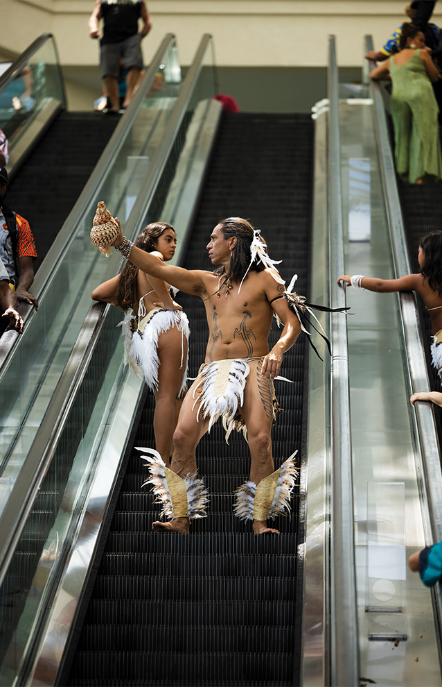 two people on an escalator