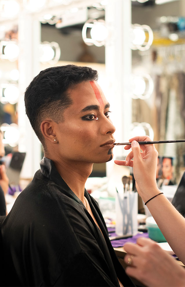 a person getting their makeup done