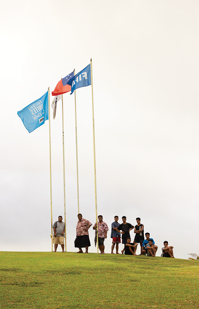 wide shot of people holding up flags