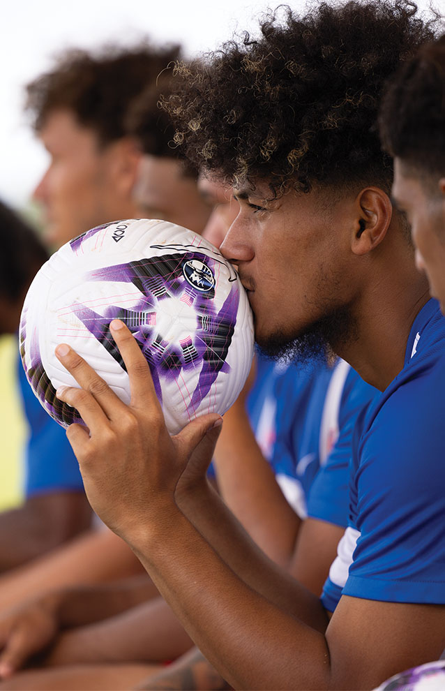 a person kissing a football
