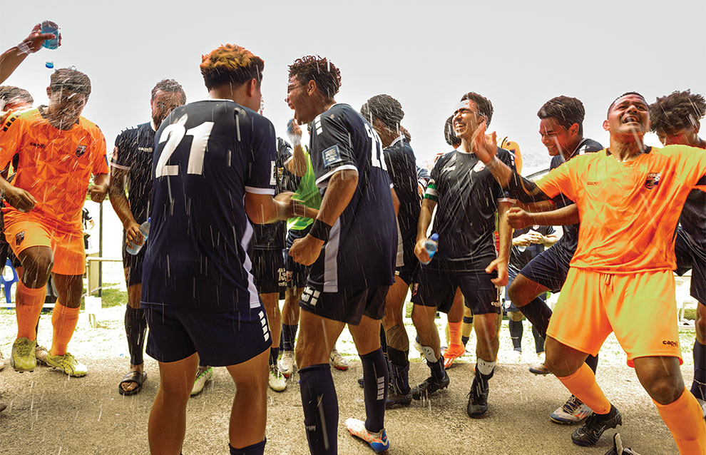 a group of people wearing team jerseys